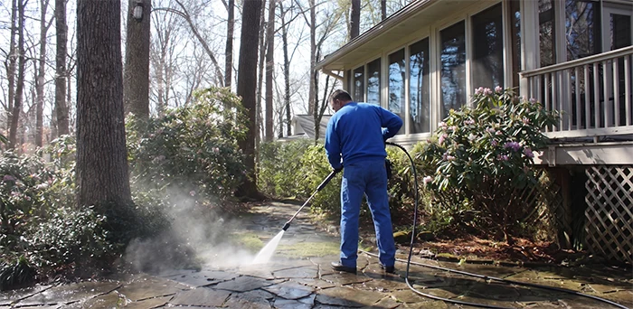 Hard surface being power washed